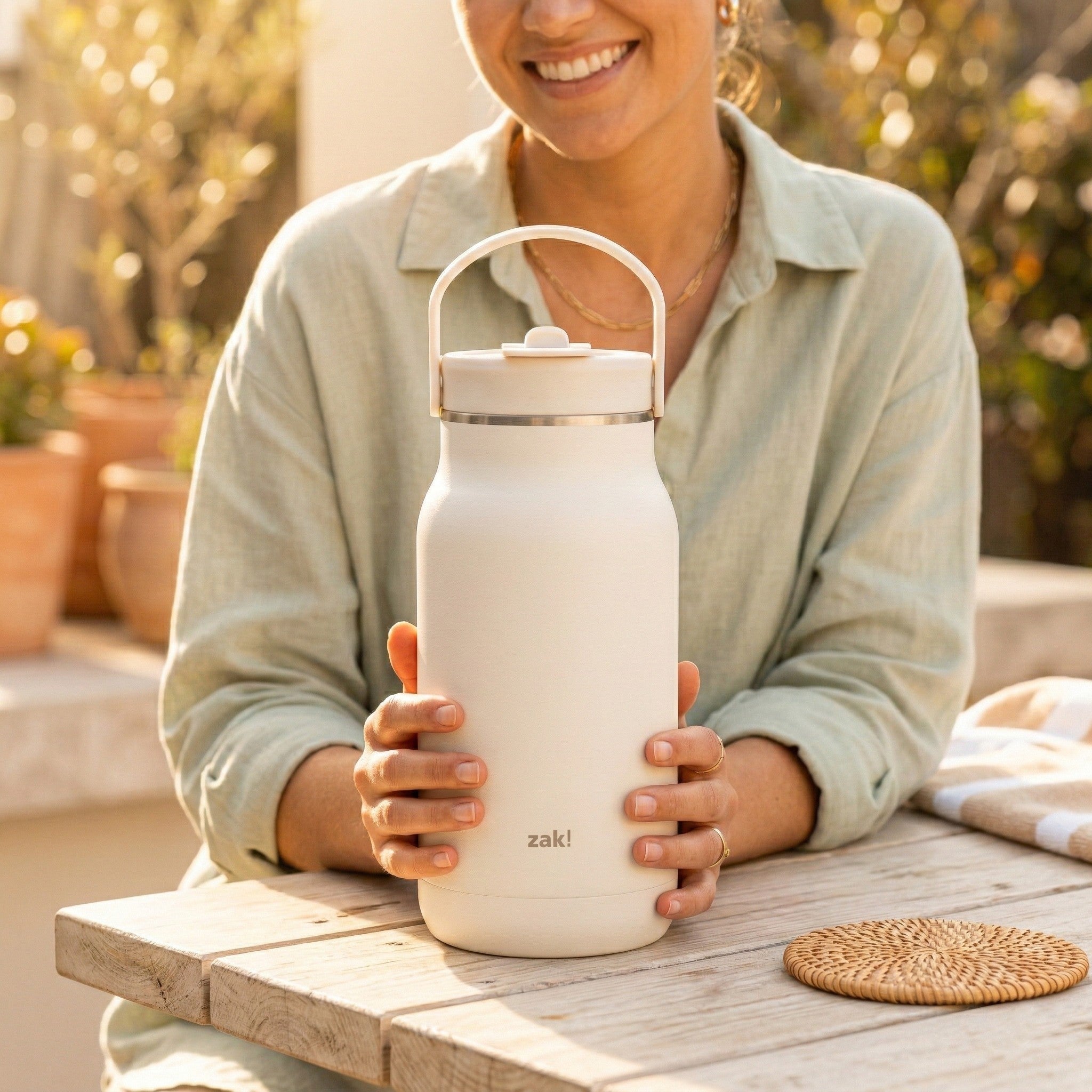 harmony64-woman-holding-tumbler.jpg